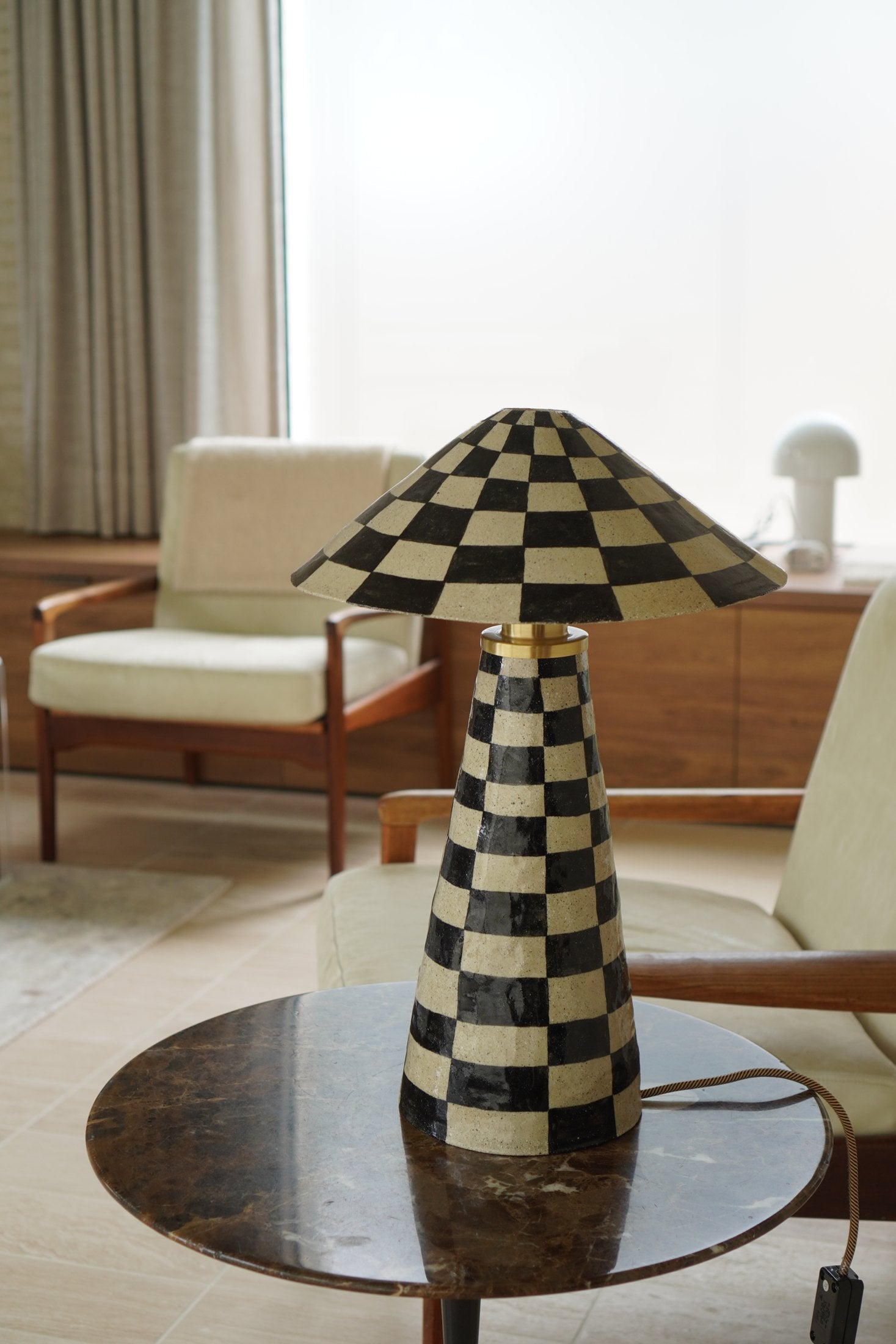 Charlie Table Lamp by Tantri Mustika in a living room