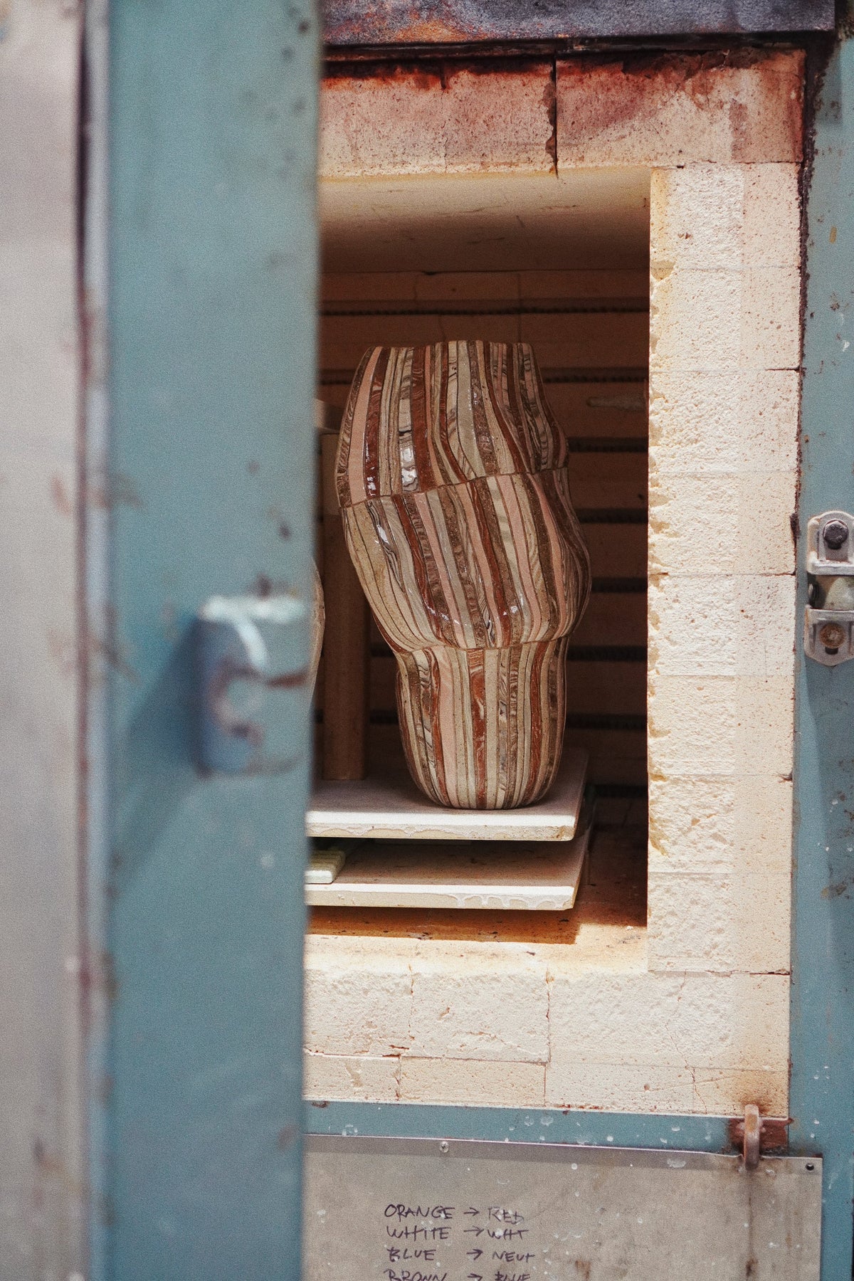 Into the kiln, in Tantri Mustika’s studio