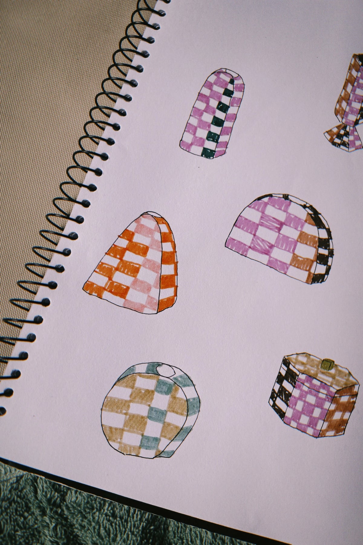 Working out checks in the sketchbook, in Tantri Mustika’s studio