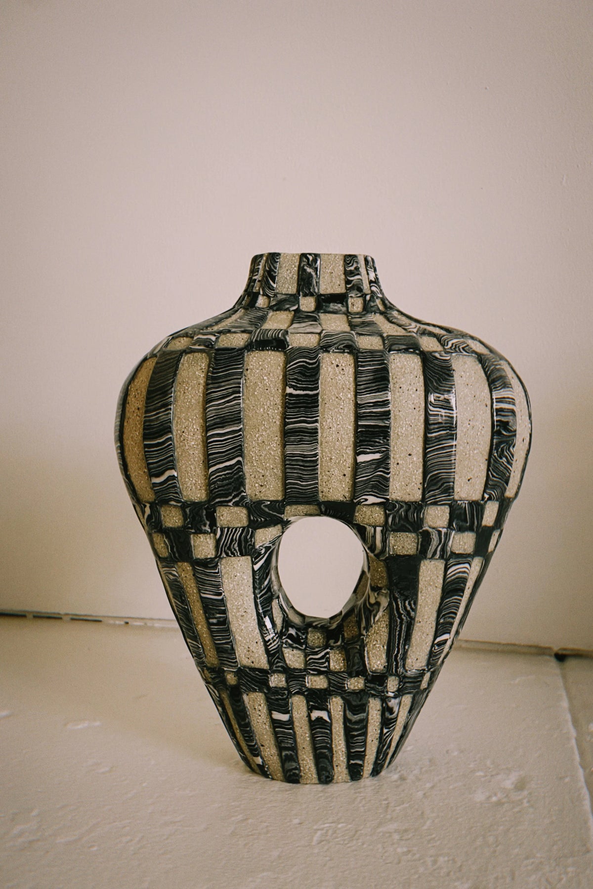 Striped vessel with an open body, Marmoreal, by Tantri Mustika
