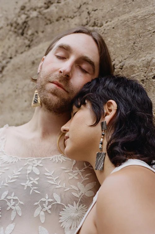 Two people wearing ceramic earrings by Tantri Mustika, Adornment 2022