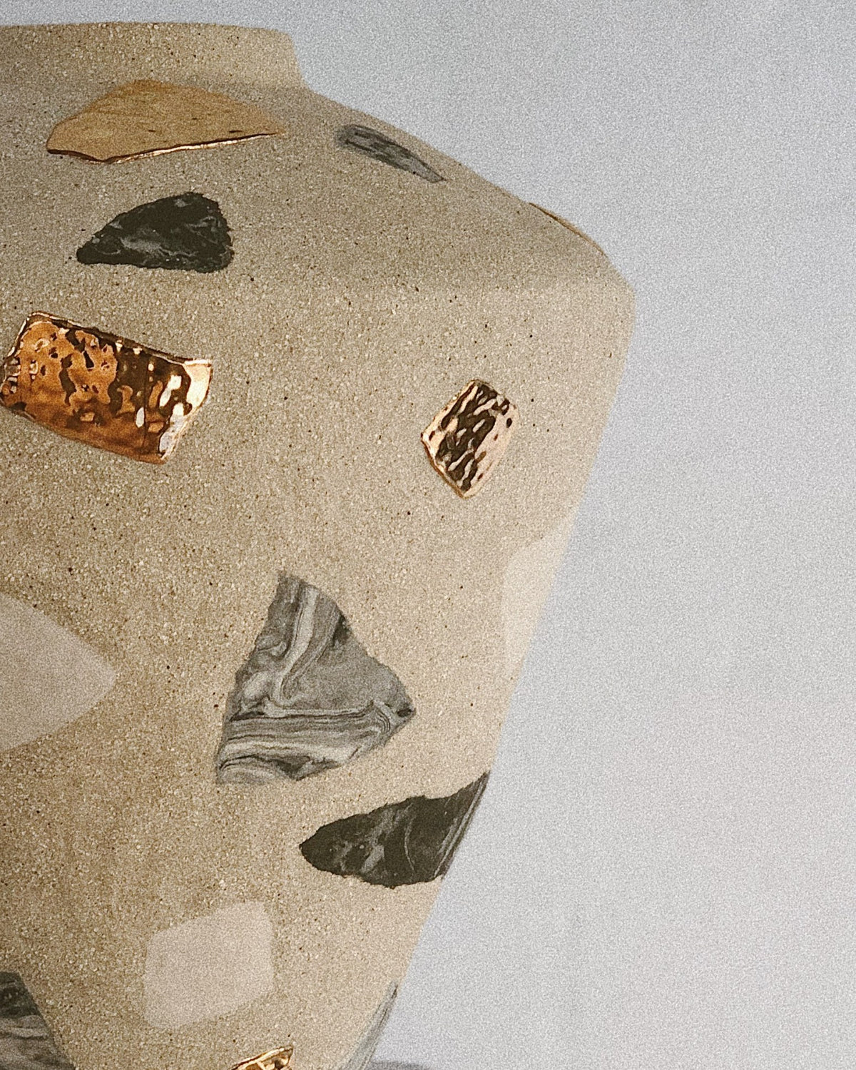 Detail of a terrazzo Relic vase by Tantri Mustika: coloured clay fragments and gold lustre set into sandy stoneware