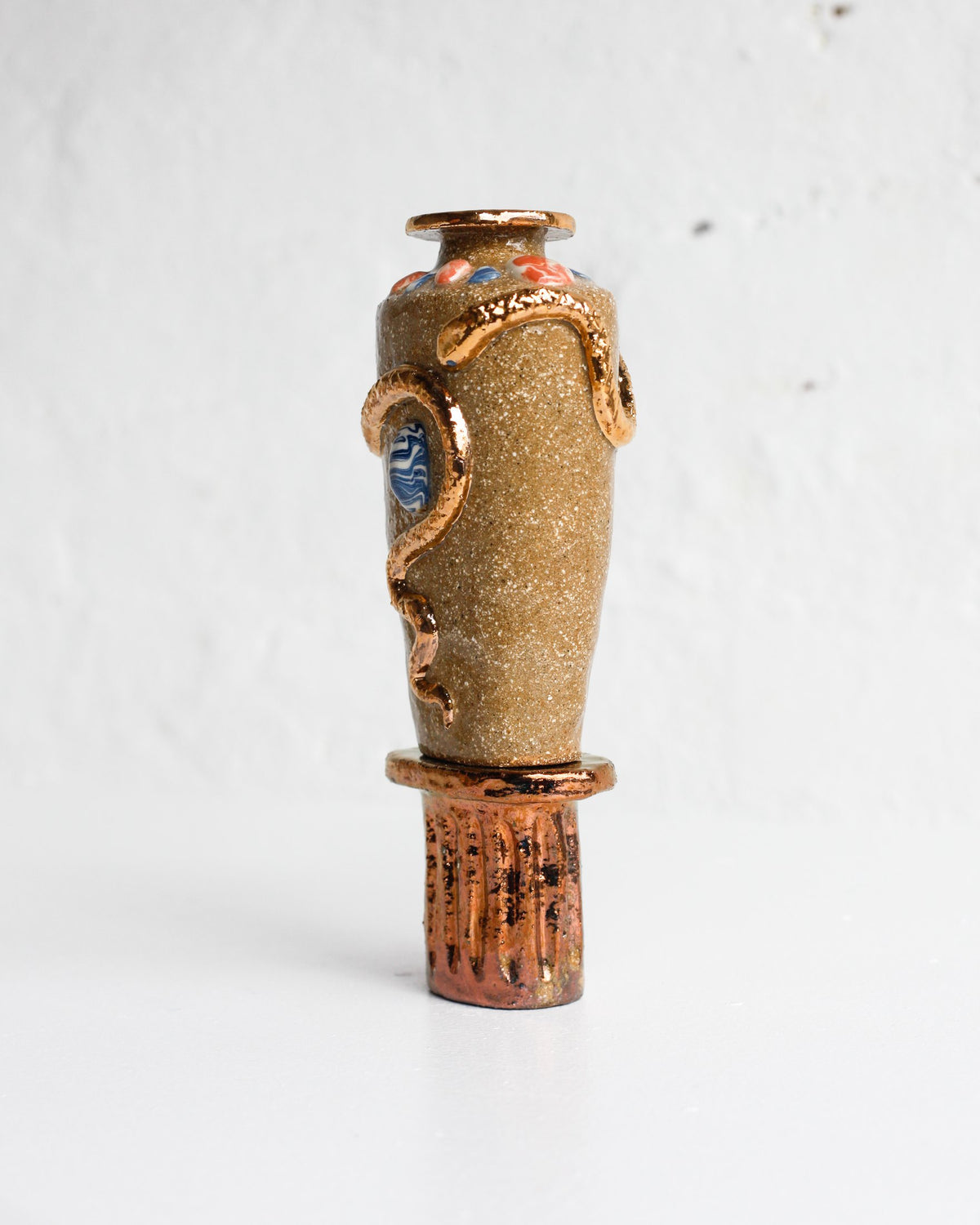 Side view of the sandy stoneware serpent vessel by Tantri Mustika, The Curiosities 2019