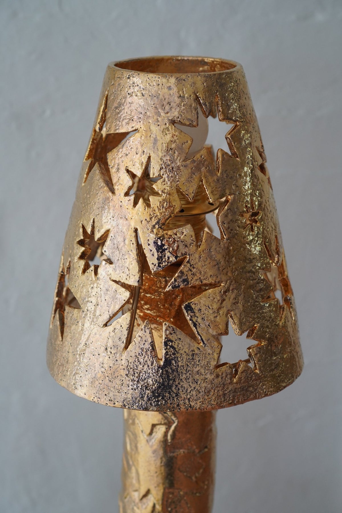 Gold lustre shade with star cut-outs, “She’s going to be very bright” by Tantri Mustika, 2024