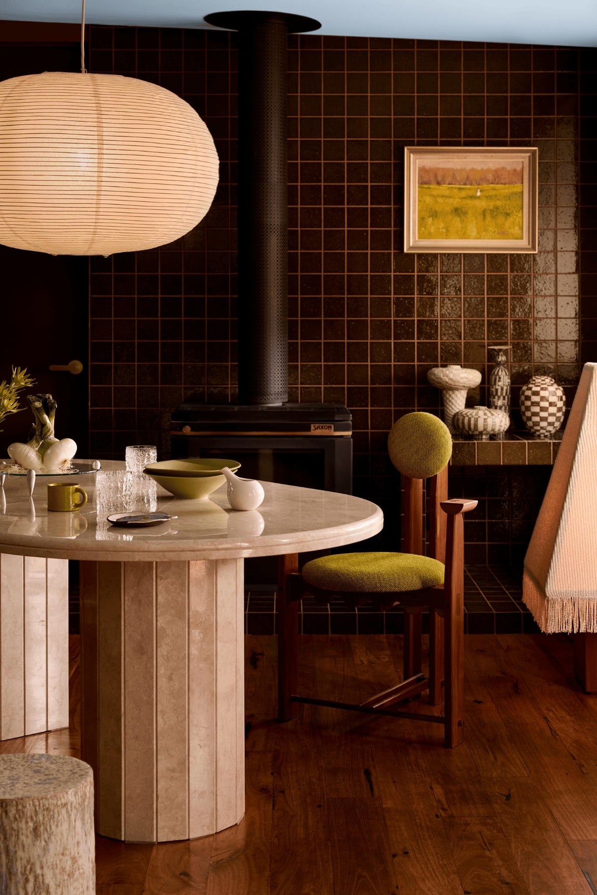 Ceramics by Tantri Mustika on the tiled fireplace in the dining room of The View by Studio Shields