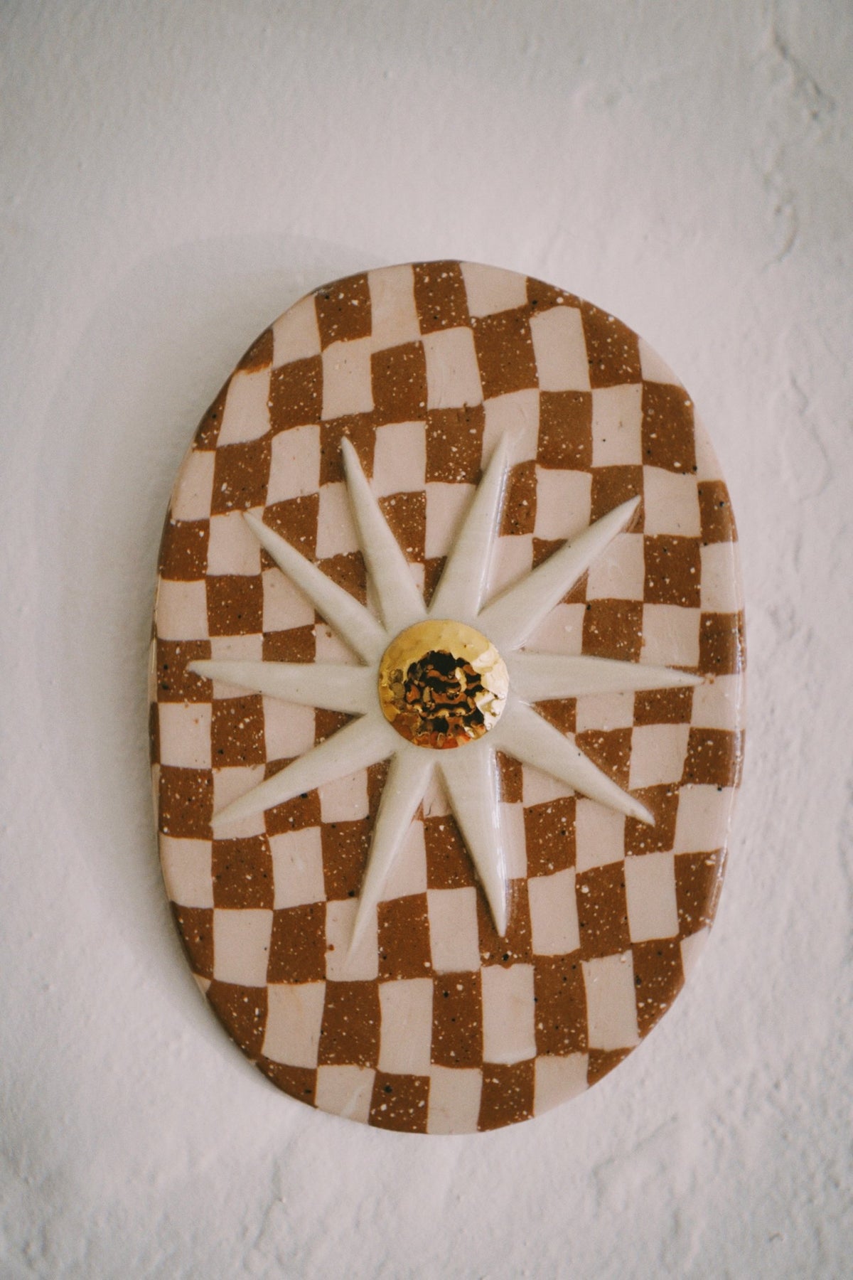 Ukiran wall plaque, checker with a gold sunflower, by Tantri Mustika