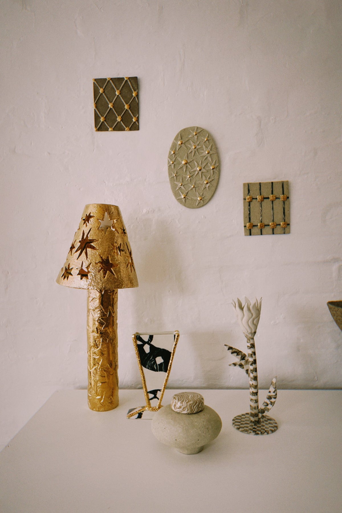 Carved ceramic wall plaque by Tantri Mustika